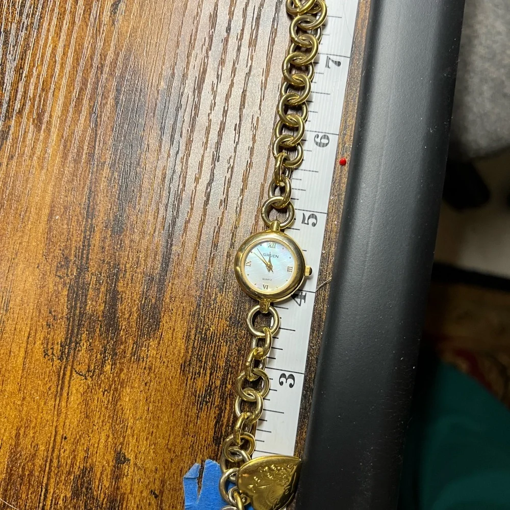 Gold-Tone Charm Bracelet Watch with Heart Locket